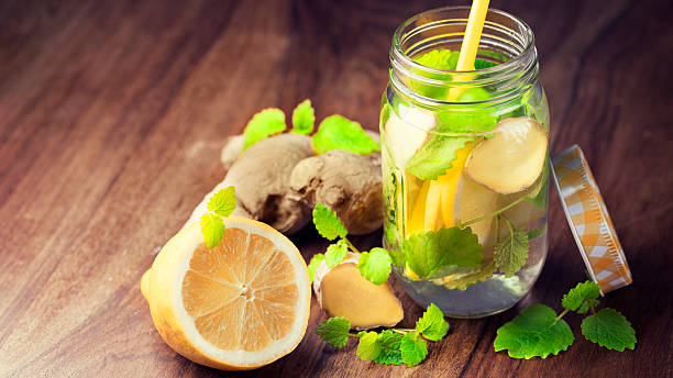 Infused water for detoxing your body with lemons, spearmint and ginger